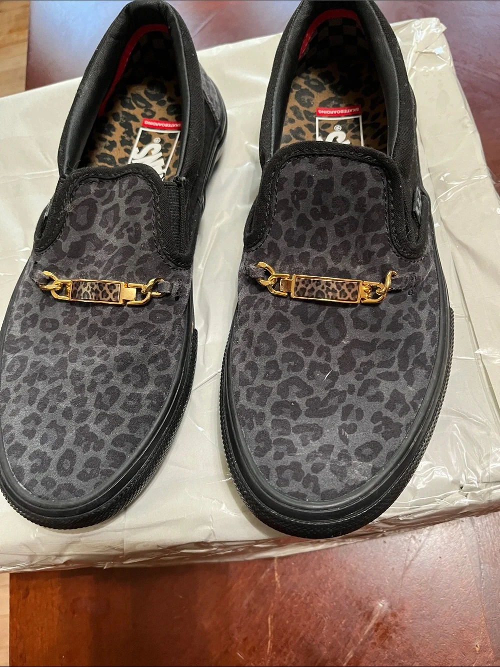 Vans Men’s Black Leopard-Print Slip-On with Gold Chain Accent